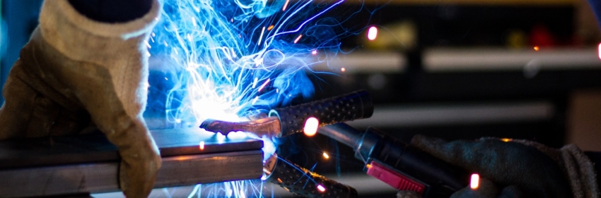A security door specialist is welding safety door design in Malaysia